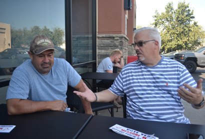 Ray Madrigal (left), a former CHP partner of Jerry Pierce, and a Lemoore City Councilman, has a chat with Pierce at Starbucks recently.